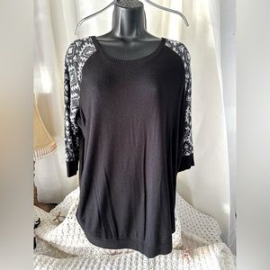 Light soft sweater black with Aztec print sleeves.